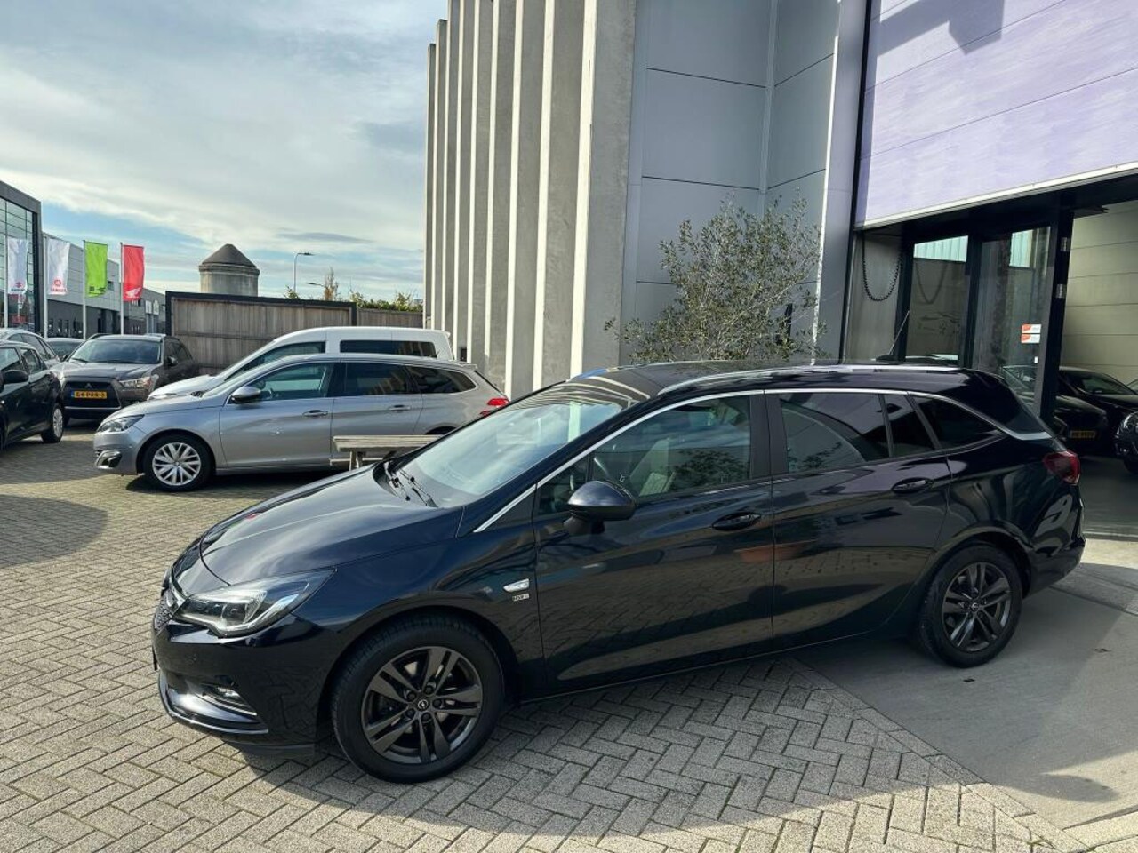 Opel Astra Sports Tourer - 1.0 Turbo 120 Jaar Edition INRUIL MOGELIJK! - AutoWereld.nl