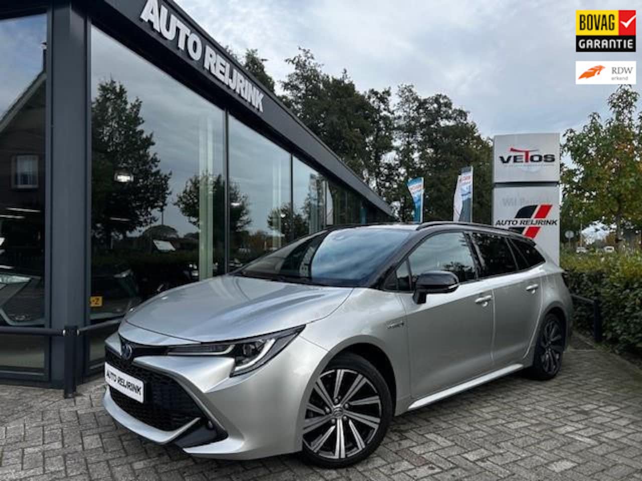 Toyota Corolla Touring Sports - 1.8 Hybrid Dynamic 1.8 Hybrid Dynamic, Bi-tone, stoel en stuur verwarming, Carplay - AutoWereld.nl