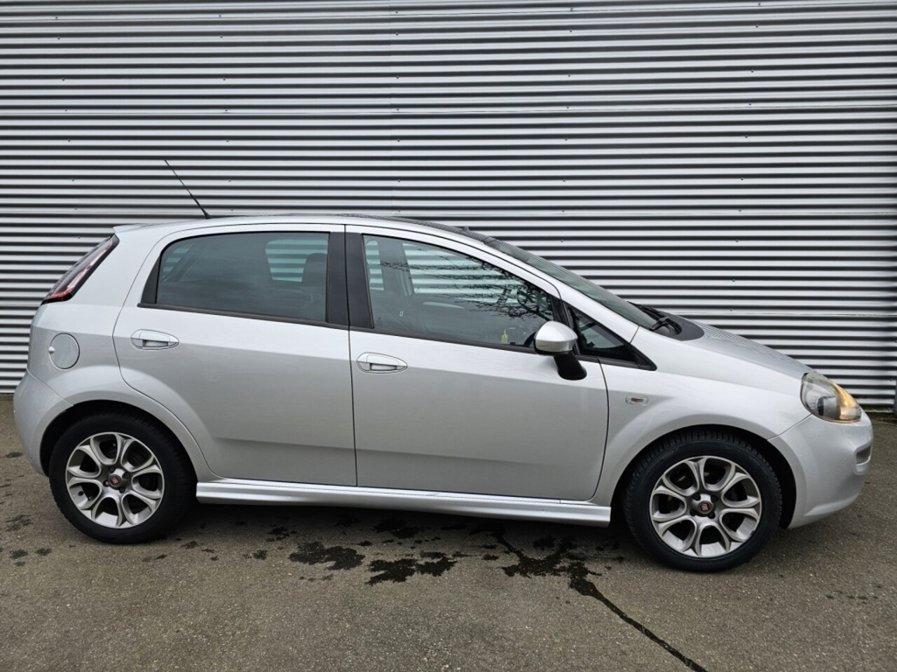 Fiat Punto Evo - 0.9 Twin Air Lounge lederen bekleding - AutoWereld.nl