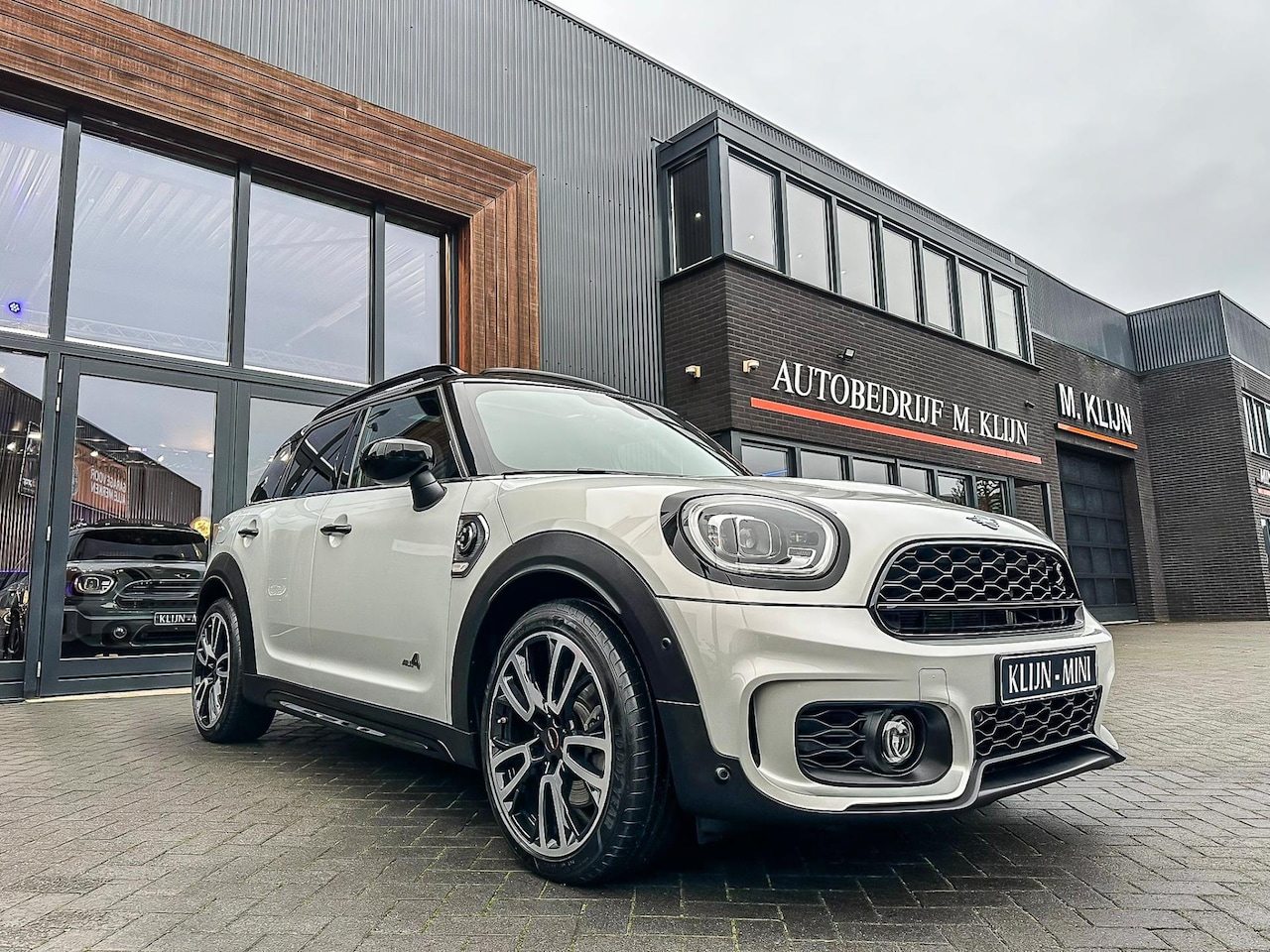 MINI Countryman - Mini 2.0 Cooper S E ALL4 John Cooper Works 220pk/pano/camera/19"/btw - AutoWereld.nl