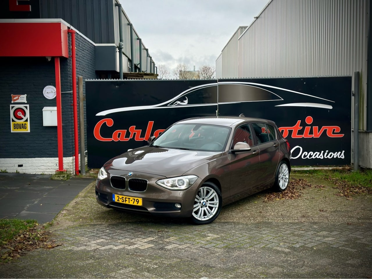 BMW 1-serie - 116i Executive LEER|CLIMA|XENON|NAVIPRO - AutoWereld.nl