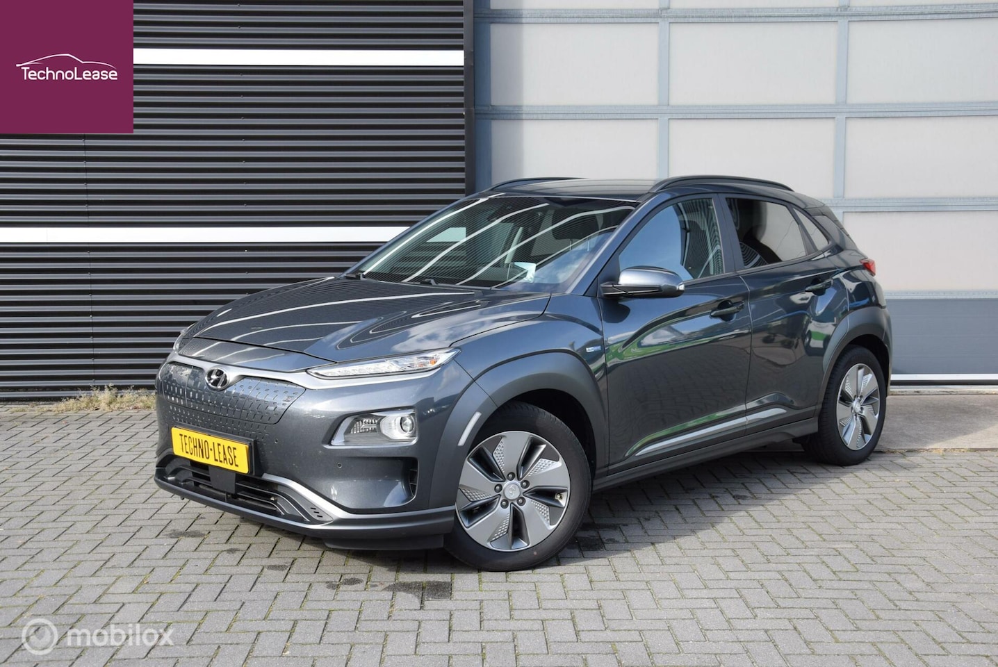 Hyundai Kona Electric - EV Premium 64 kWh + Trekhaak - AutoWereld.nl