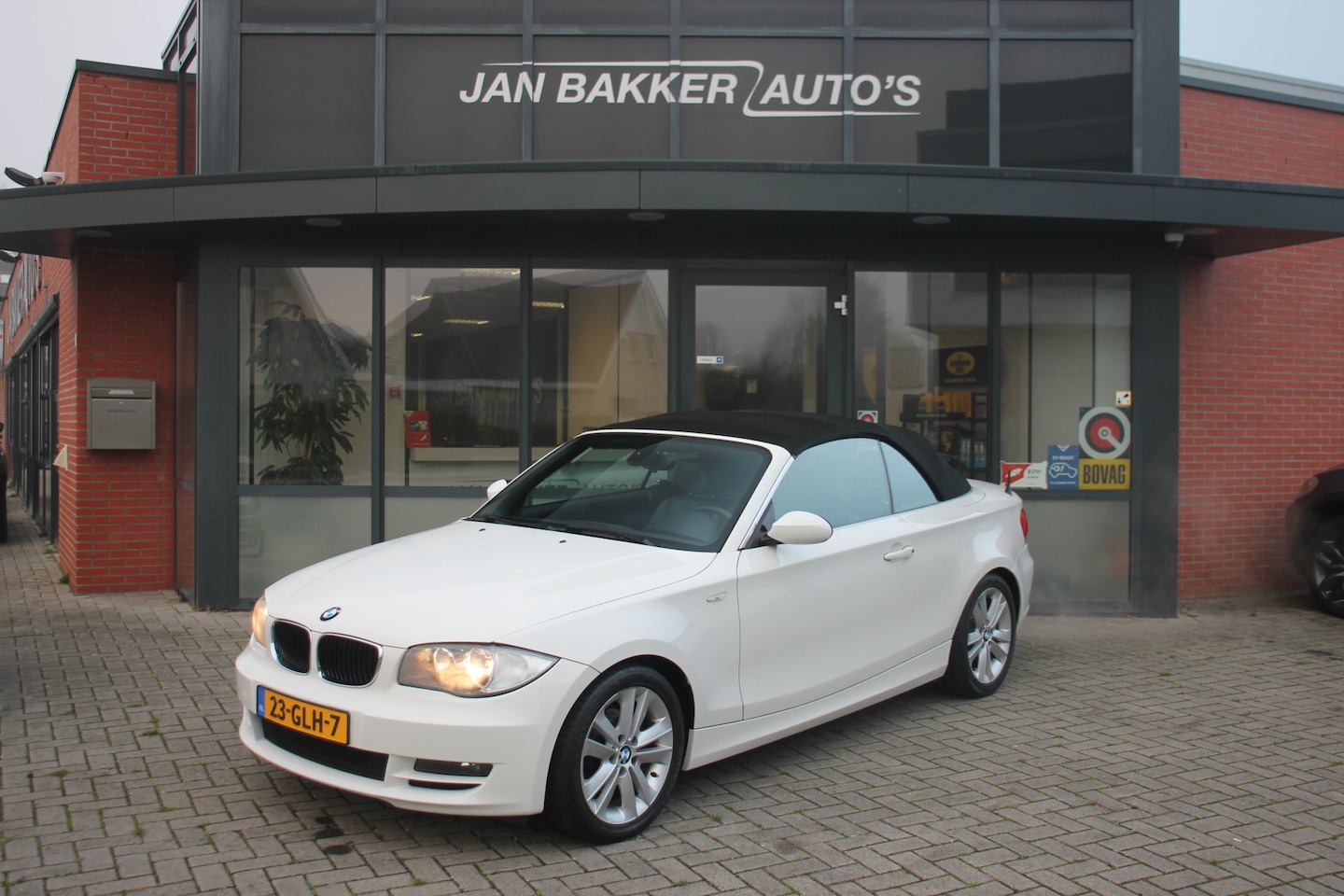 BMW 1-serie Cabrio - 118i High Executive ✅ Leer ✅ NL-auto ✅ NAP ✅ 17inch - AutoWereld.nl