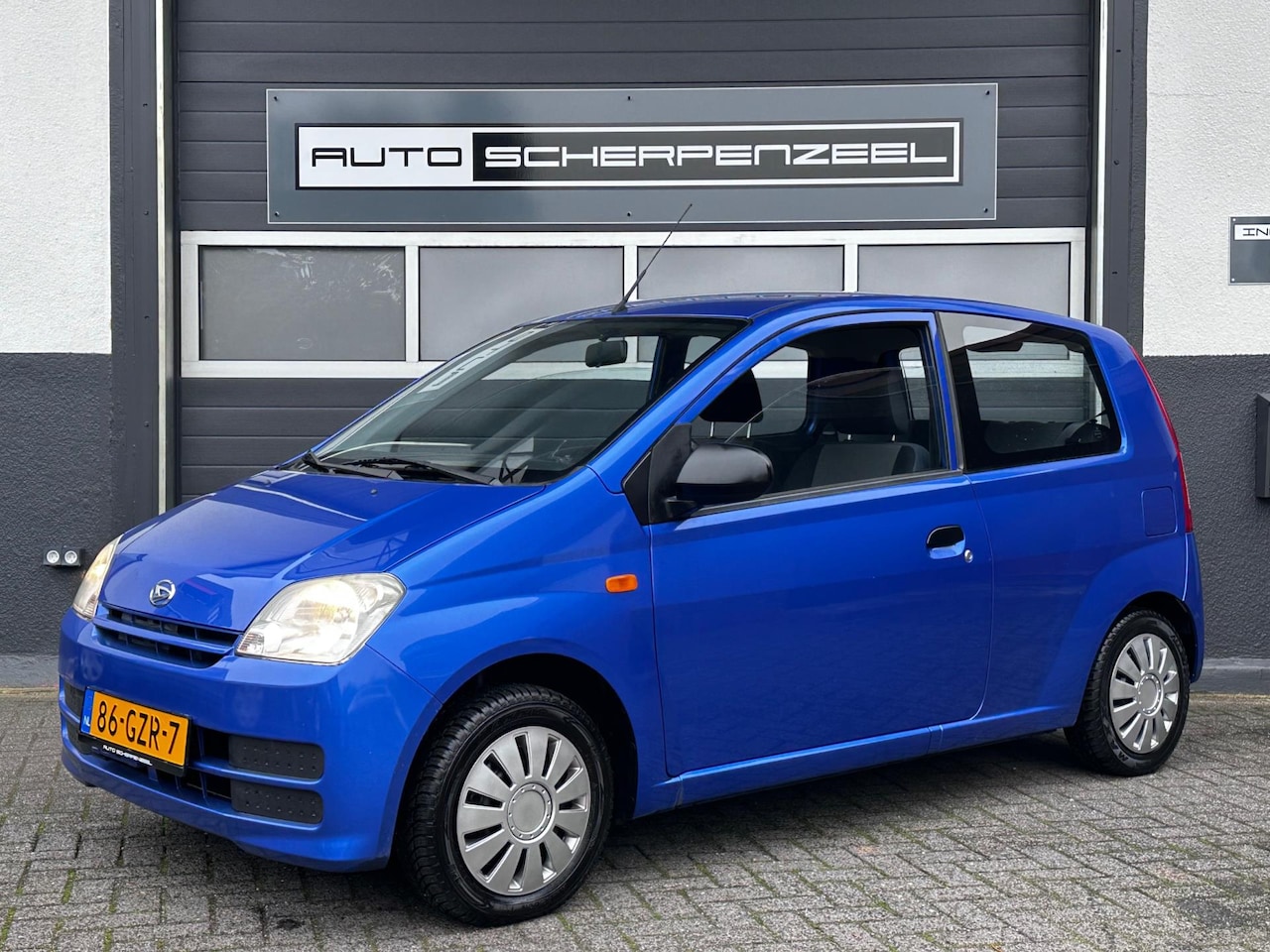 Daihatsu Cuore - 1.0-12V 100th Anniversary I 67 dkm I ZUINIG I NL AUTO - AutoWereld.nl