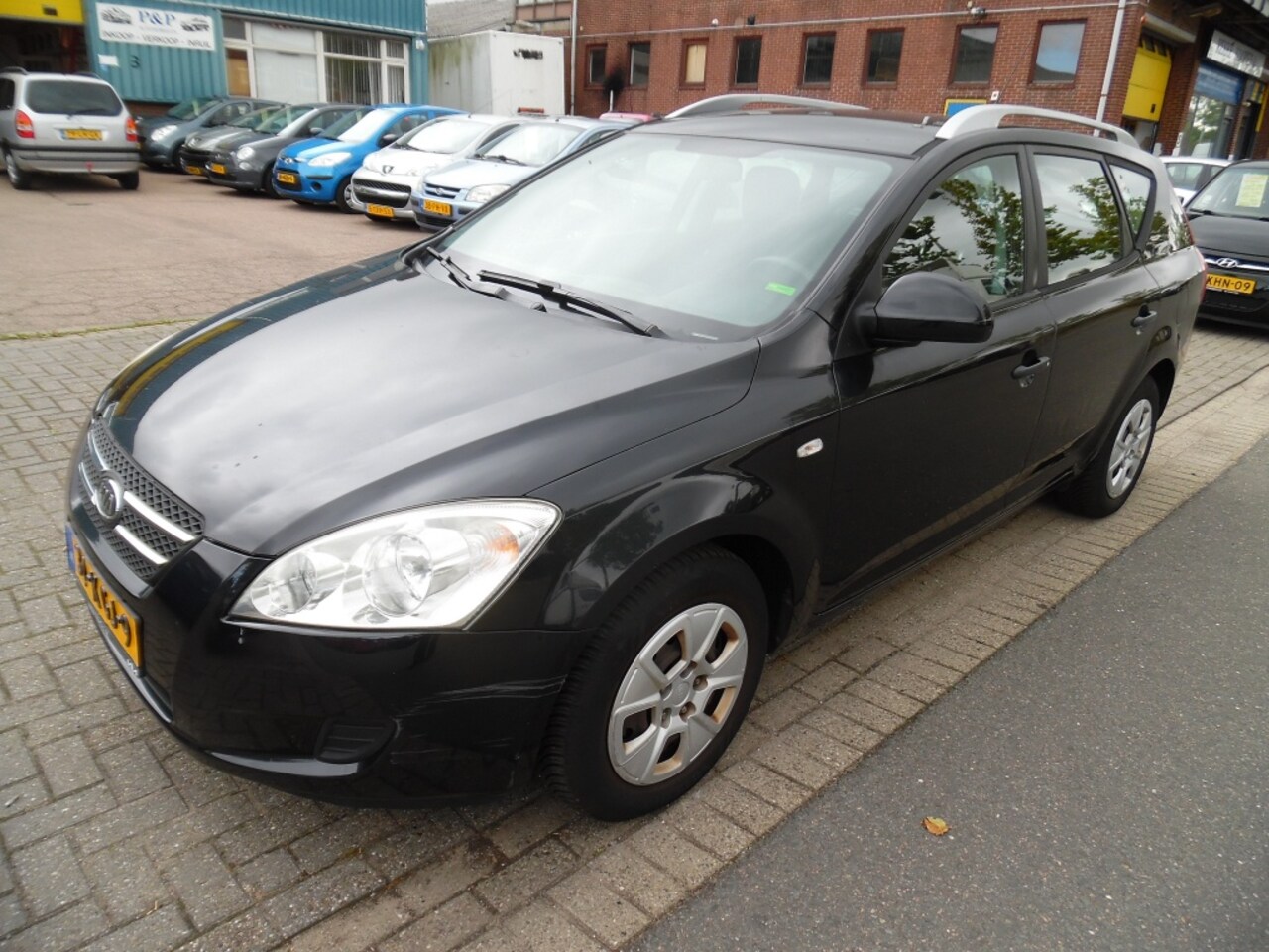 Kia Cee'd Sporty Wagon - 1.4 CVVT X-tra apk 8.24 - AutoWereld.nl