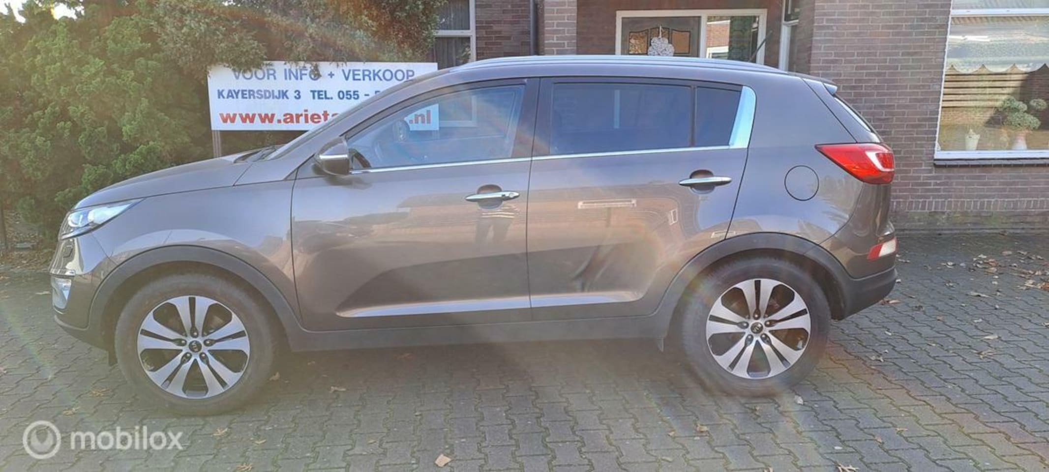 Kia Sportage - 2.0 X-clusive NAVI-CLIMA-LEER - AutoWereld.nl