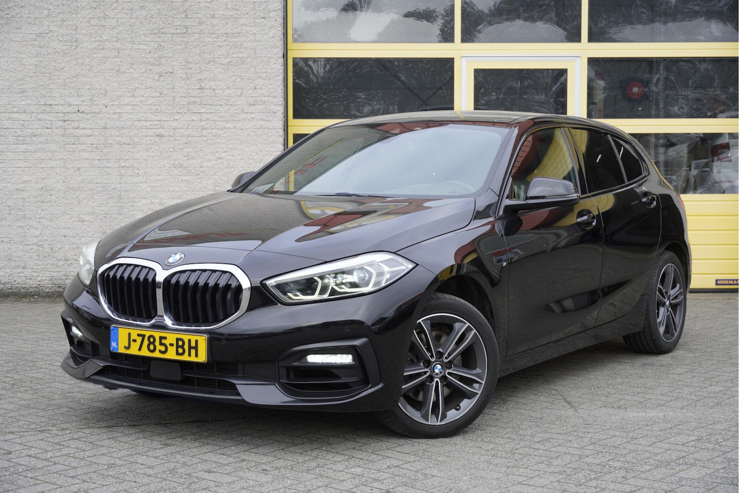 BMW 1-serie - 118i Automaat! Executive Sport BJ2020 Lmv 17" | Led | Pdc | Navi | Afneembare trekhaak | H - AutoWereld.nl