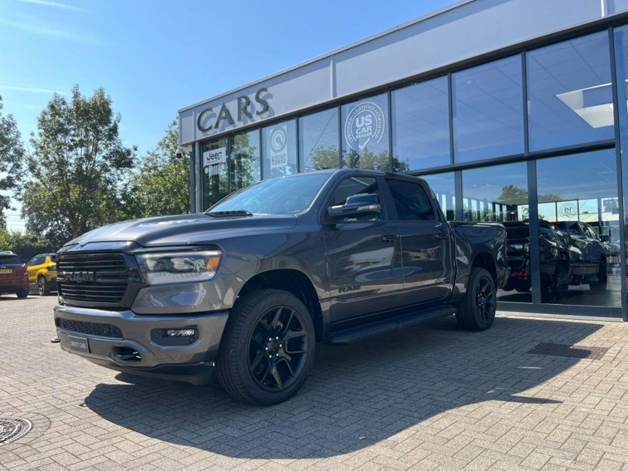 Dodge Ram Pick Up - 5.7 Hemi  4x4 Laramie Luchtvering  Multi. achterklep  Ram Box. - AutoWereld.nl