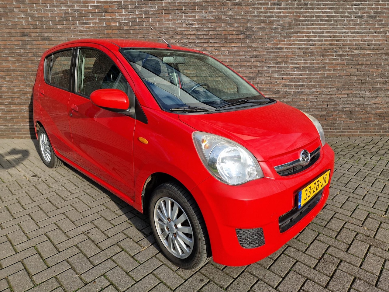 Daihatsu Cuore - 1.0 Premium airco elektr ramen APK 12-2025 - AutoWereld.nl