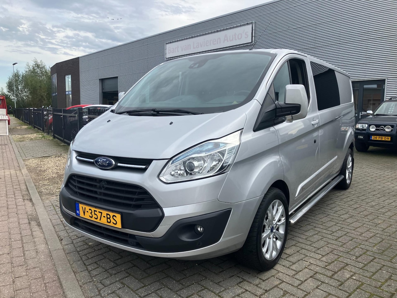 Ford Transit Custom - 290 2.2 TDCI L2H1 Anniversary Edition Dubbel Cabine - AutoWereld.nl