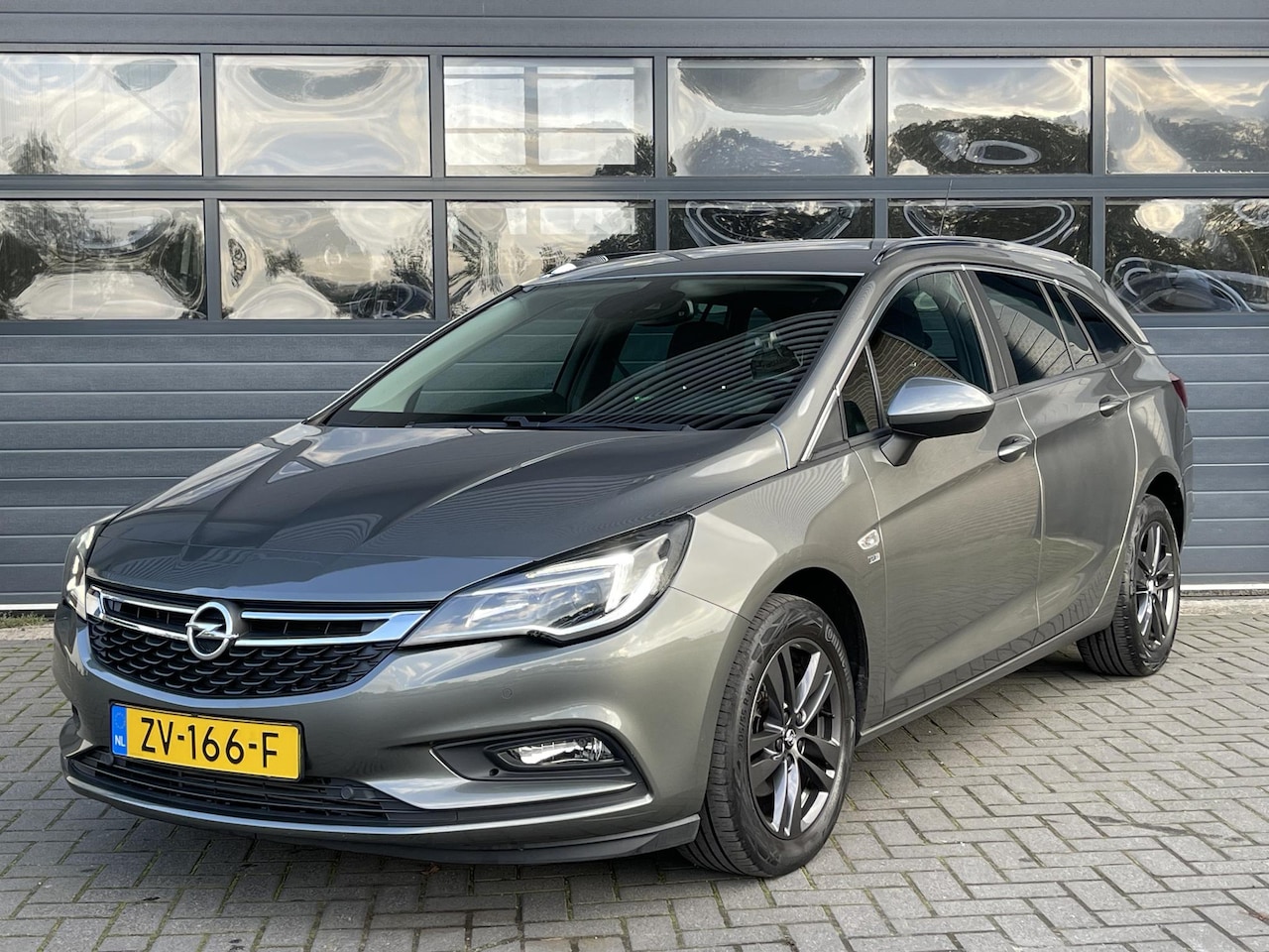 Opel Astra Sports Tourer - 1.0 TURBO 120 JAAR EDITION I APPLE/ANDROID I PARKEERSENSOREN I CLIMATE CONTROL I CRUISE CO - AutoWereld.nl