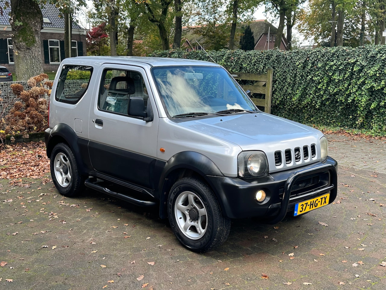 Suzuki Jimny - 1.3 JX 2WD - AutoWereld.nl