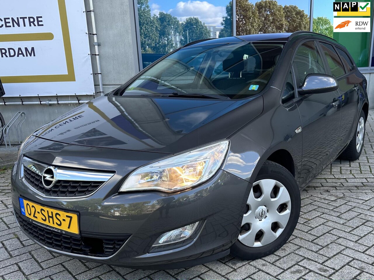 Opel Astra Sports Tourer - 1.4 Turbo Edition AIRCO/NAVI/3DEEIG/NAP/APK - AutoWereld.nl