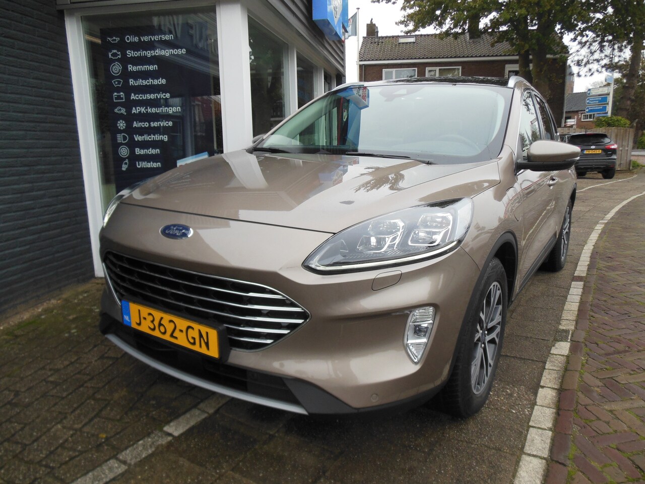 Ford Kuga - 2.5 PHEV Titanium X 12 maanden Bovag garantie trekhaak pano dak - AutoWereld.nl