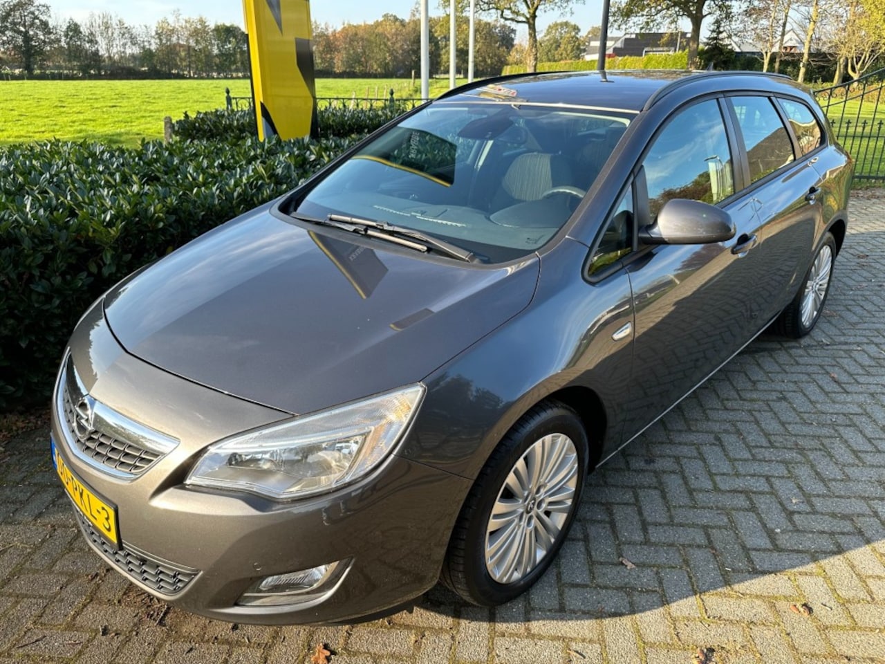 Opel Astra Sports Tourer - Sports Tourer 1.4 Edition Cruise / PDC / Navi - AutoWereld.nl