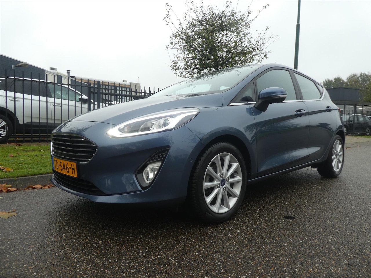 Ford Fiesta - 1.0 EcoBoost 100pk AUTOMAAT 5dr Titanium Parkeer Camera Navigatie - AutoWereld.nl