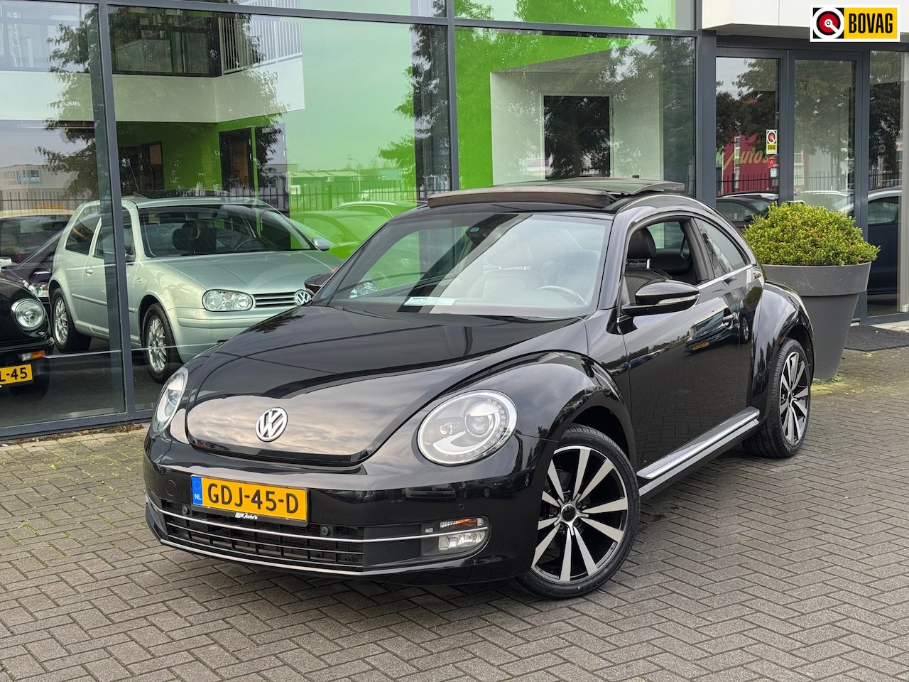 Volkswagen Beetle - 1.2 TSI Design * Panoramadak * Xenon * Navigatie * Leder - AutoWereld.nl