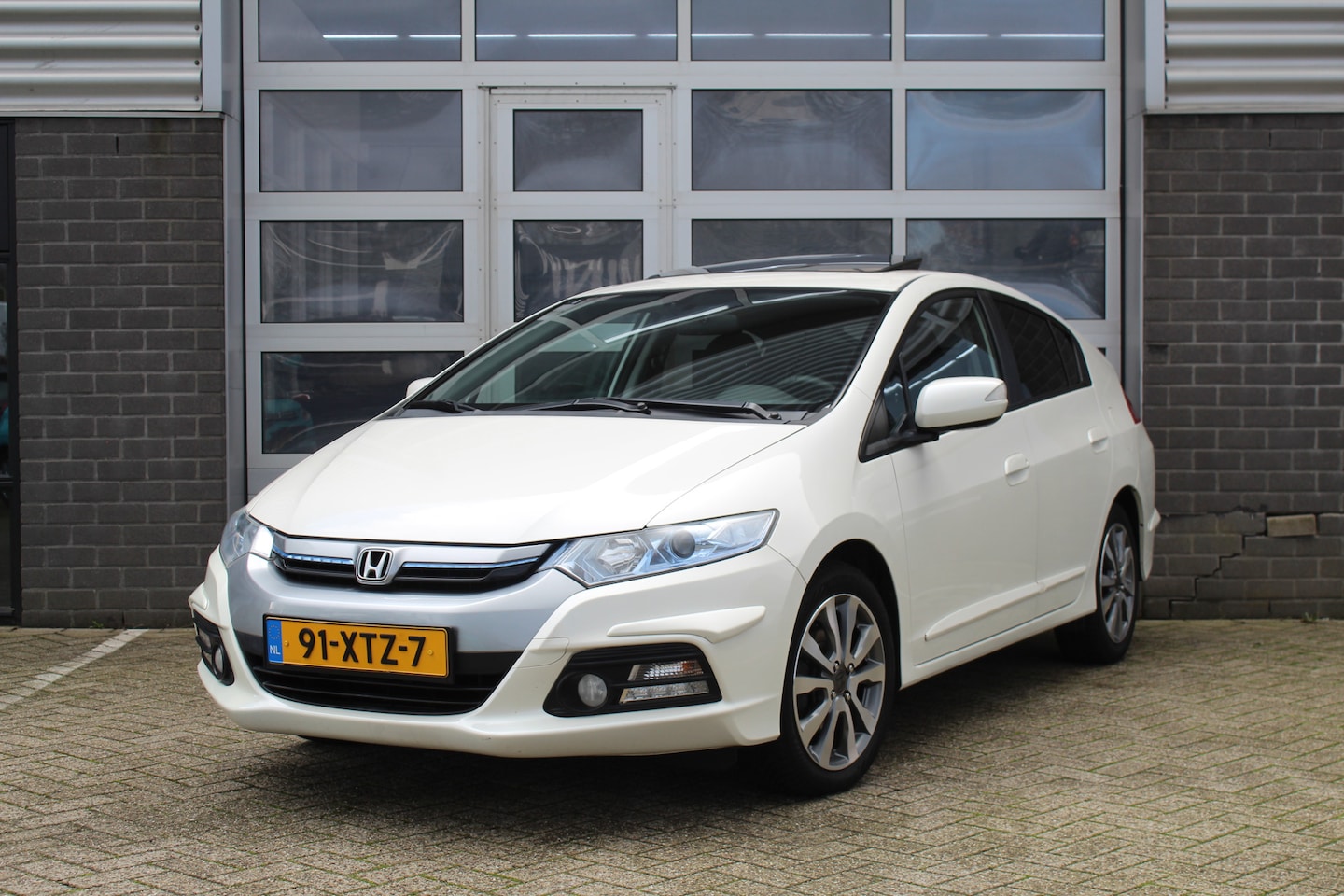 Honda Insight - 1.3 Exclusive / Navigatie / Stoelverwarming / Schuifdak / N.A.P. - AutoWereld.nl