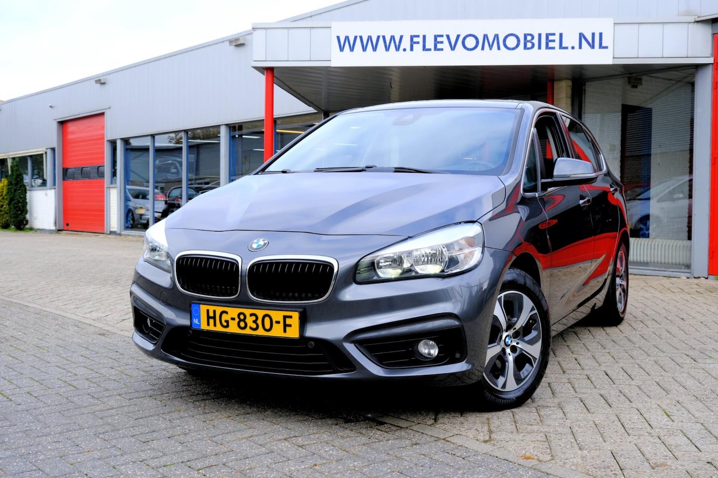 BMW 2-serie Active Tourer - 218i Essential Aut. Pano|1e Eig|Navi|HUD|LMV - AutoWereld.nl