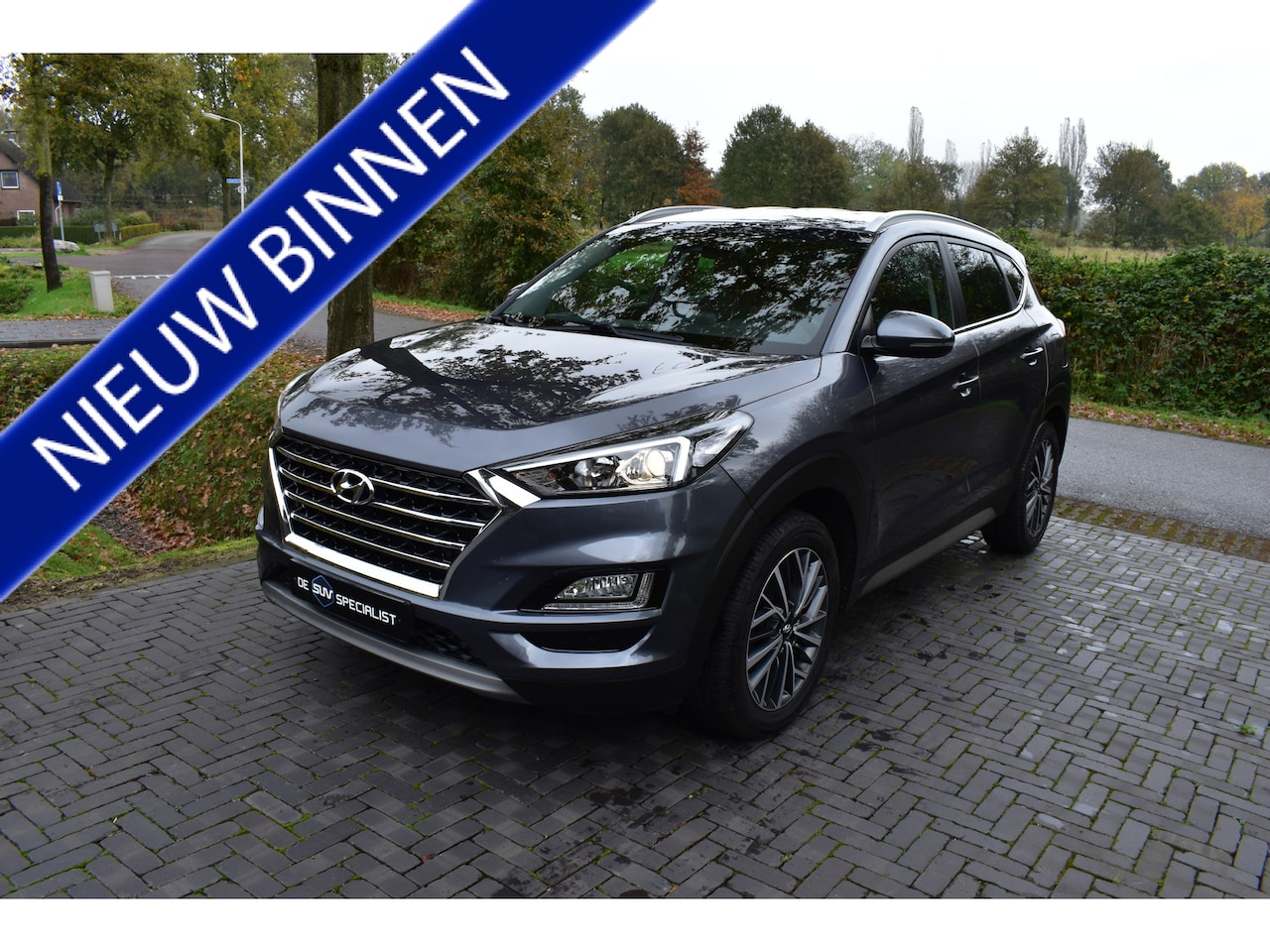 Hyundai Tucson - 1.6 T-GDI Premium 177PK AUT. LEER, APPLE, TREKH. 72DKM! - AutoWereld.nl