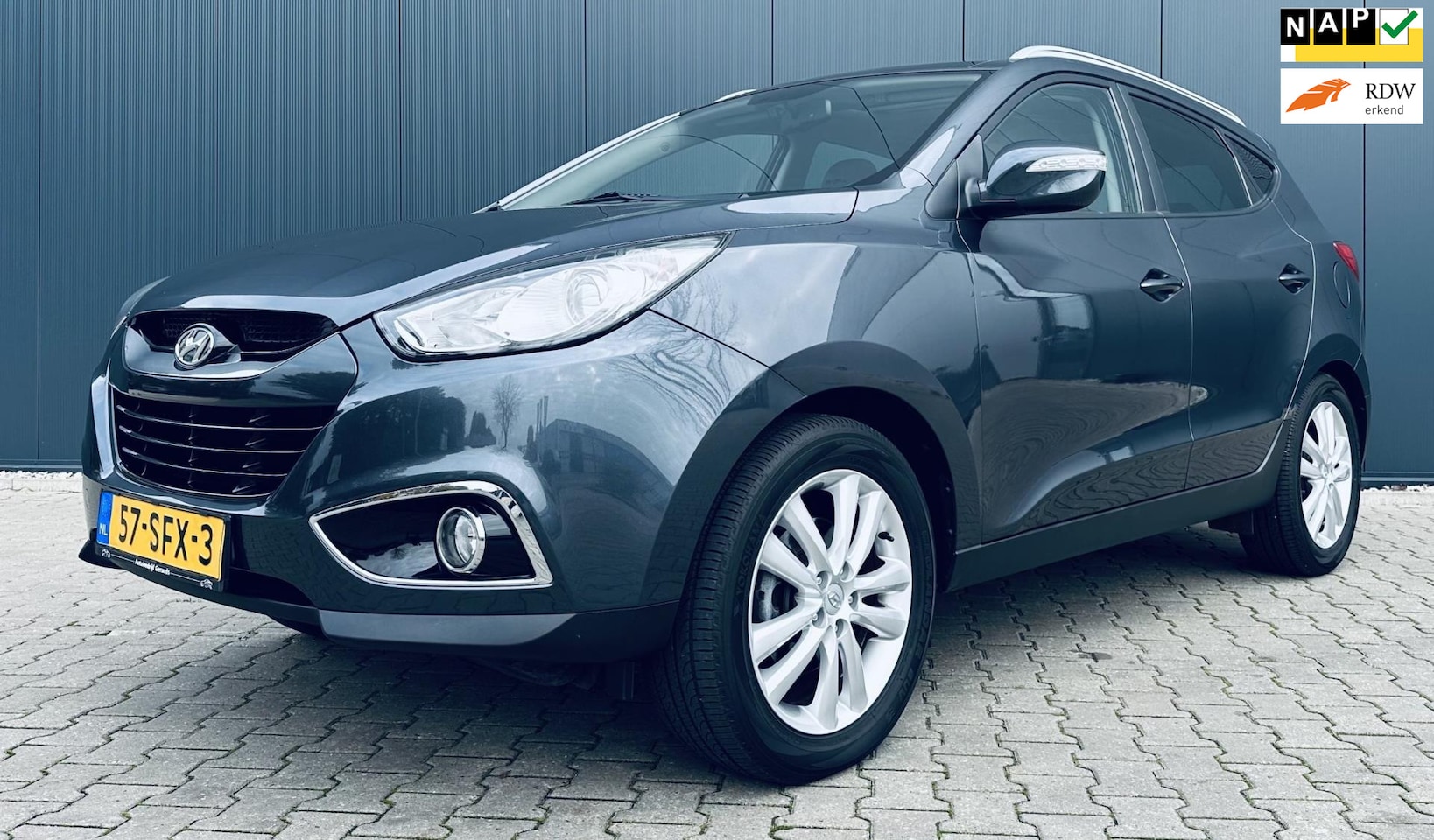 Hyundai ix35 - 2.0i 4WD i-Catcher Airco cruise Pano Navi Trekhaak - AutoWereld.nl