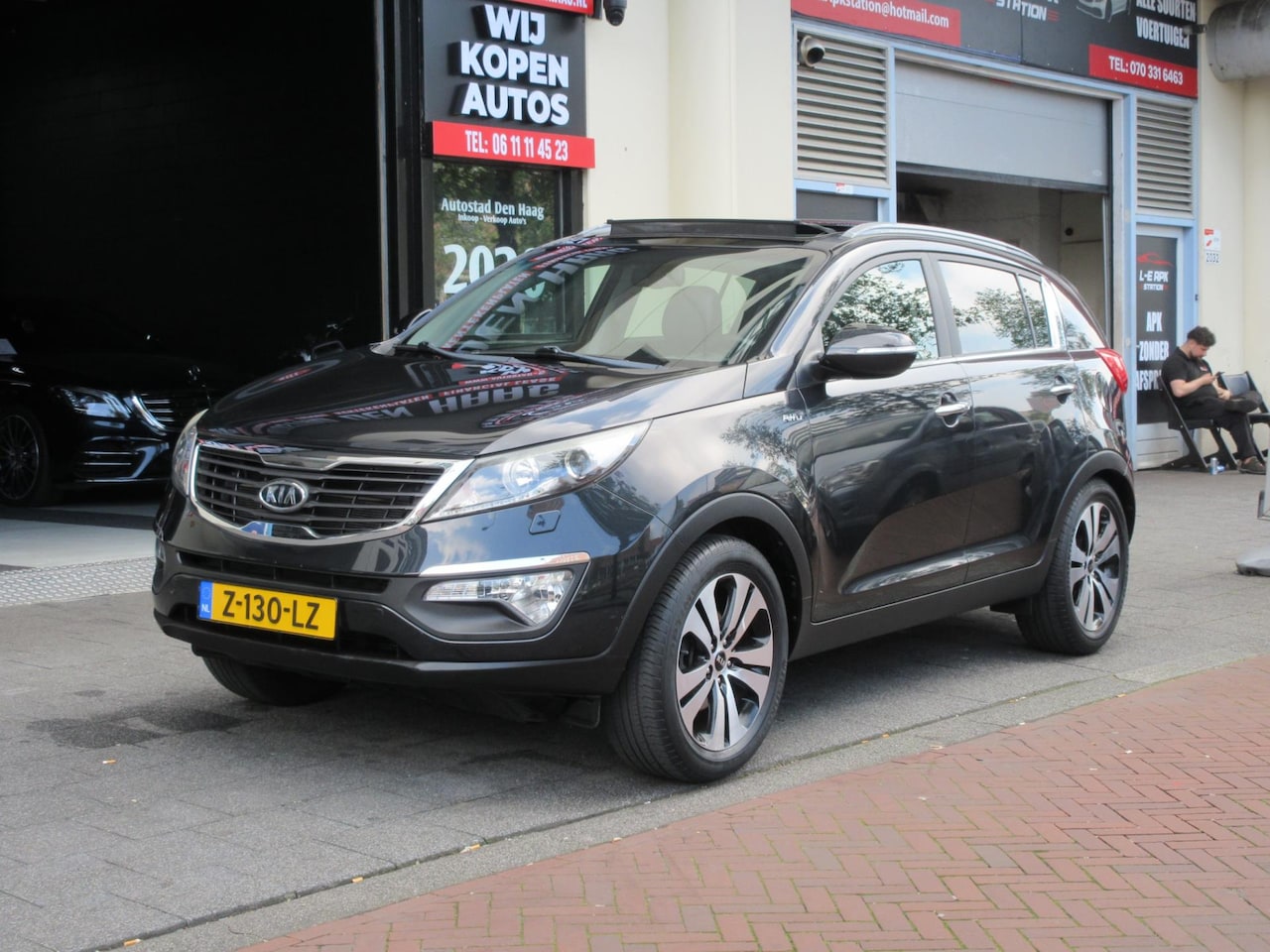 Kia Sportage - 2.0 X-clusive 4wd Aut Leer Navi Clima Pano - AutoWereld.nl