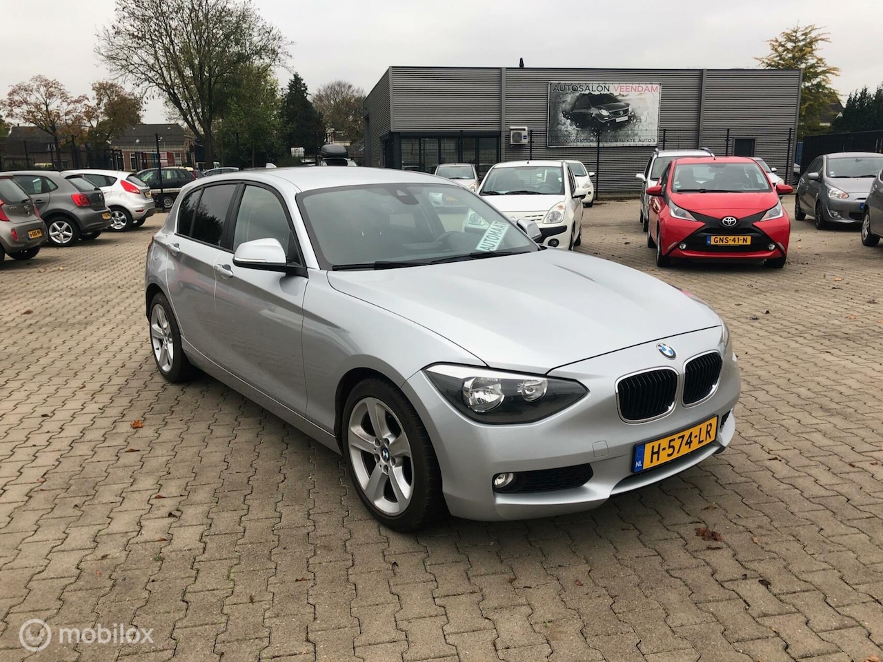 BMW 1-serie - 116i 5DRS HB AUTOMAAT AIRCO ECC NAVI 116.361 KM - AutoWereld.nl