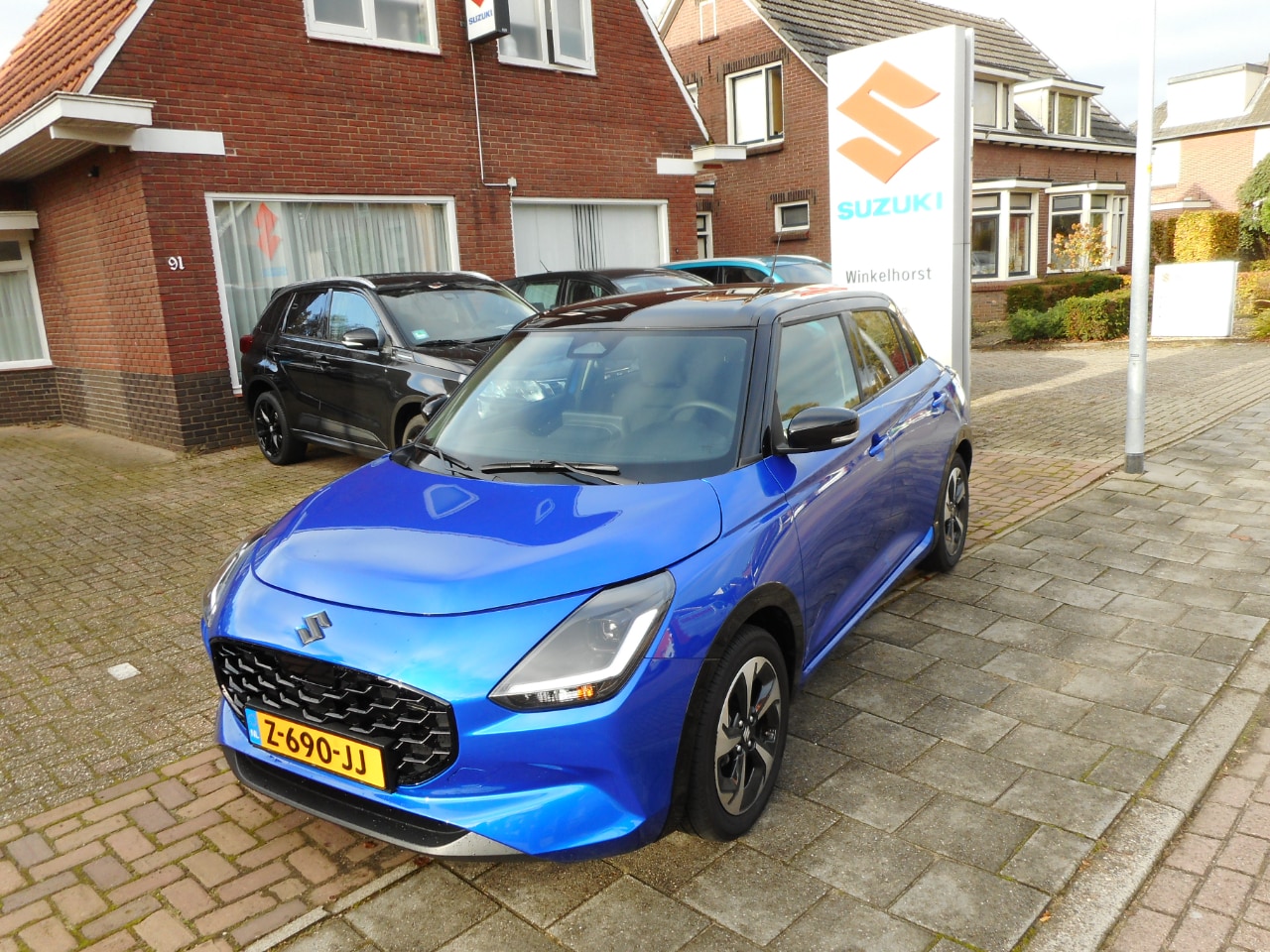 Suzuki Swift - 1.2 SMART HYBRID STYLE - AutoWereld.nl