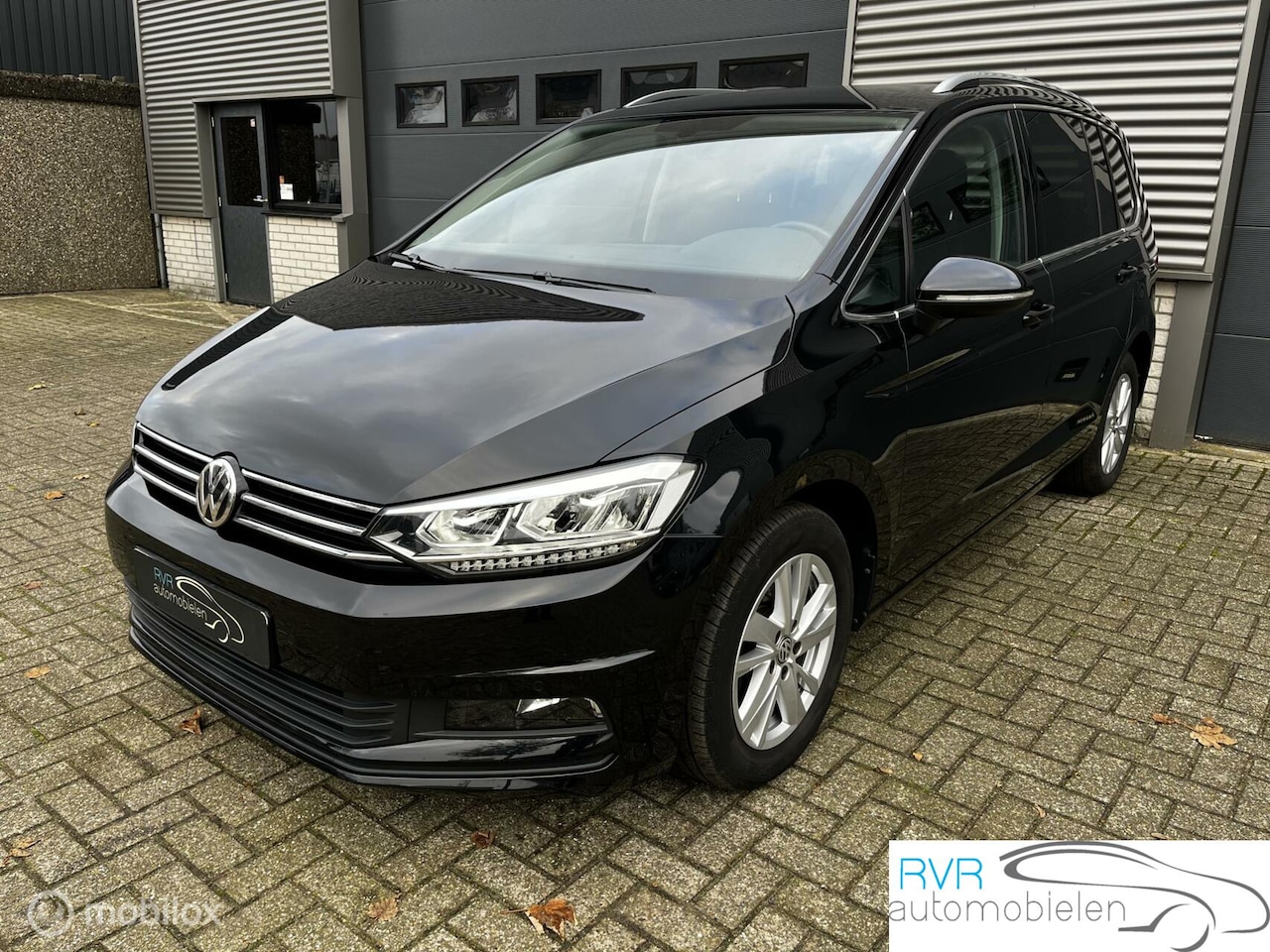 Volkswagen Touran - 1.5 TSI Highline 7PERS AUTOMAAT/NAVI/CRUISE - AutoWereld.nl