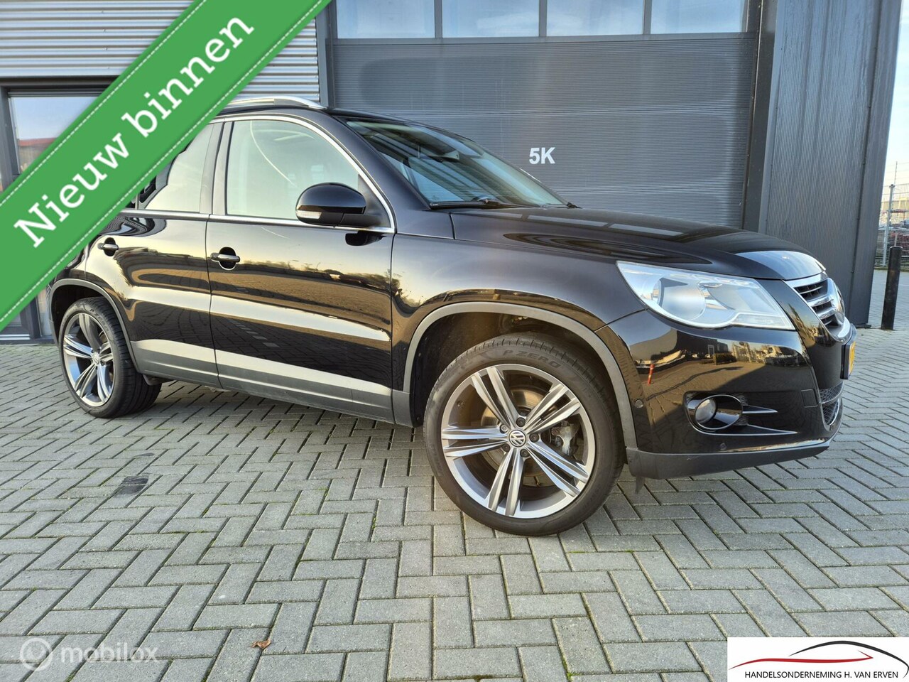 Volkswagen Tiguan - 1.4 Sport&Style SCHUIFKANTELDAK NAVI 19" - AutoWereld.nl