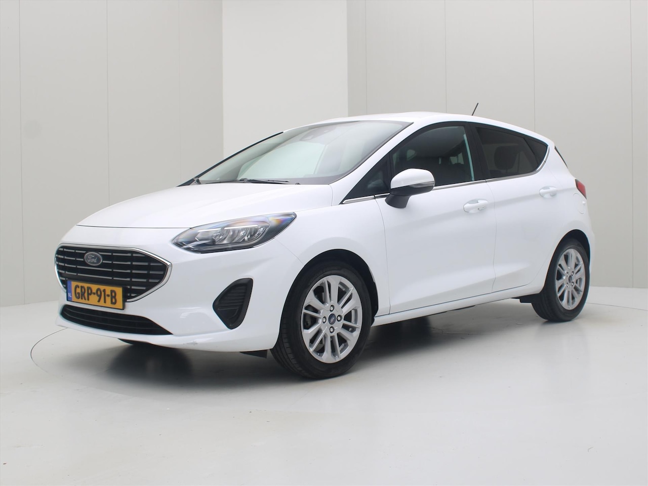 Ford Fiesta - 1.0 EcoBoost 100pk 6-Bak Titanium [ LED+NAVI+CRUISE+CARPLAY+STOEL/STUURWIELVERWARMING ] - AutoWereld.nl