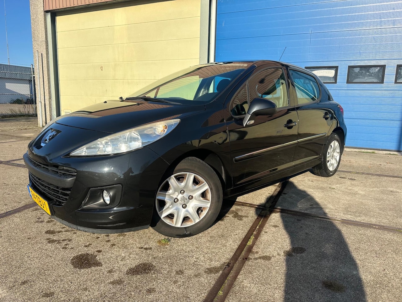 Peugeot 207 - 1.4 Acces Lite Airco! 5-DRS! Zwart! 2012 - AutoWereld.nl