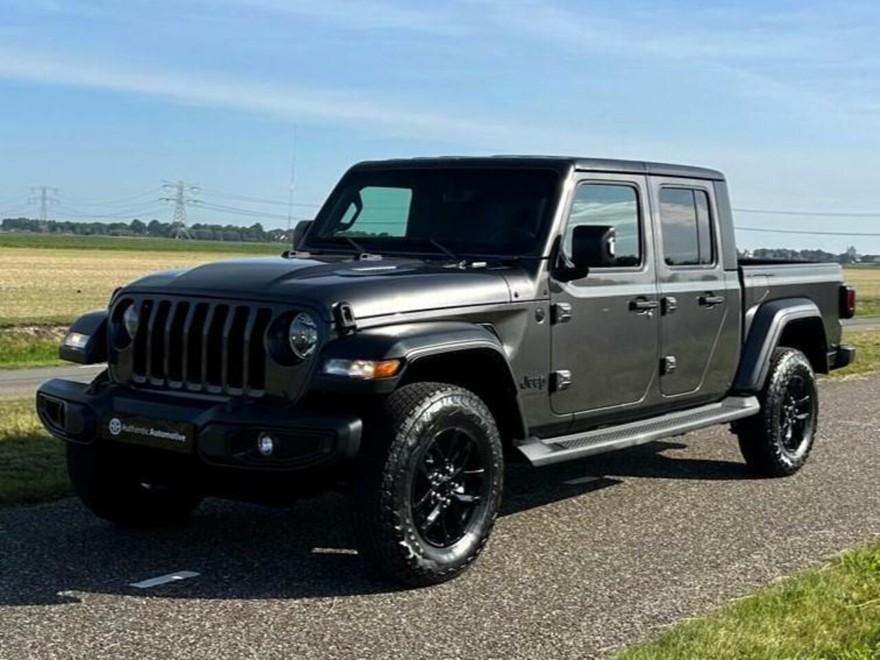 Jeep Gladiator - sport 3.6i Benzine Grijs kenteken NL..NIEUW.! - AutoWereld.nl