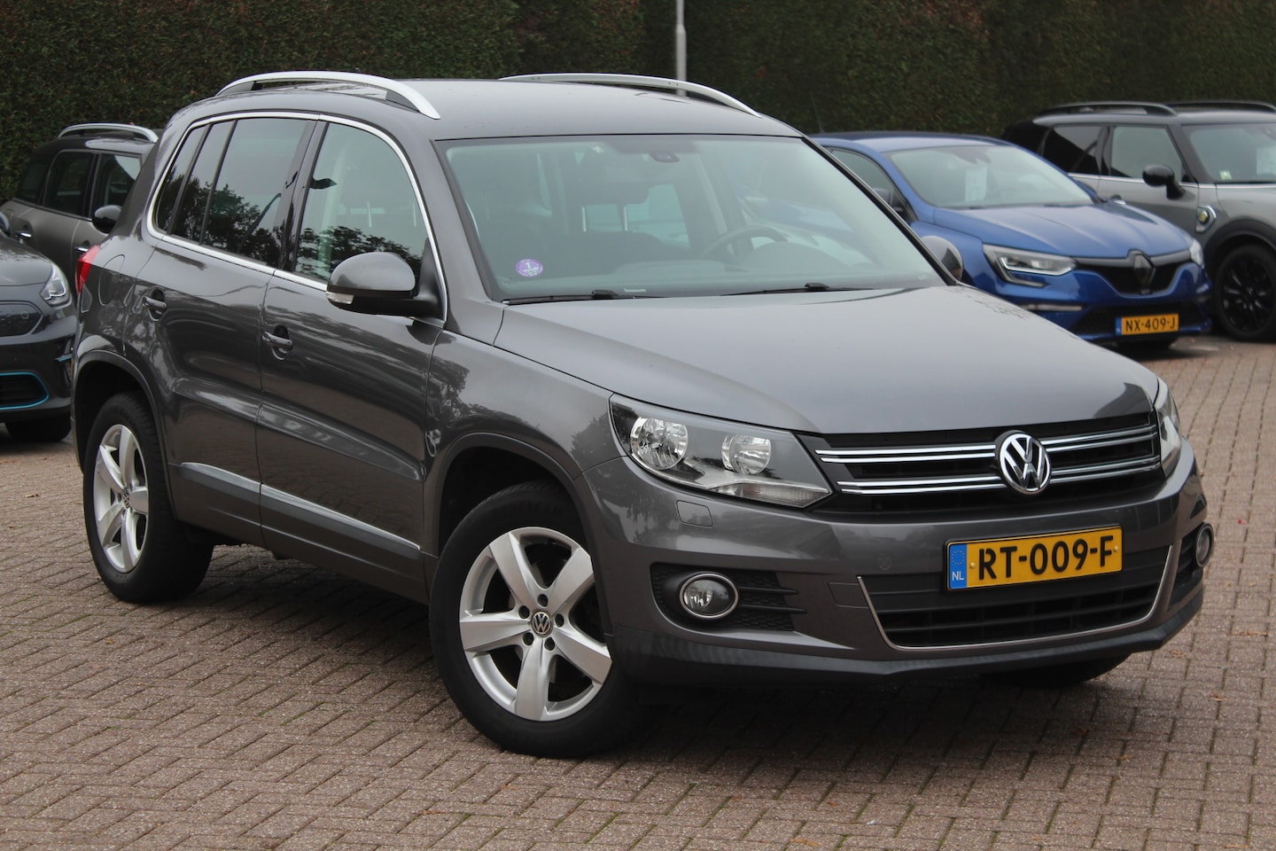 Volkswagen Tiguan - 1.4 TSI Highline / Navigatie / Parkeerhulp V+A / Cruise Control - AutoWereld.nl