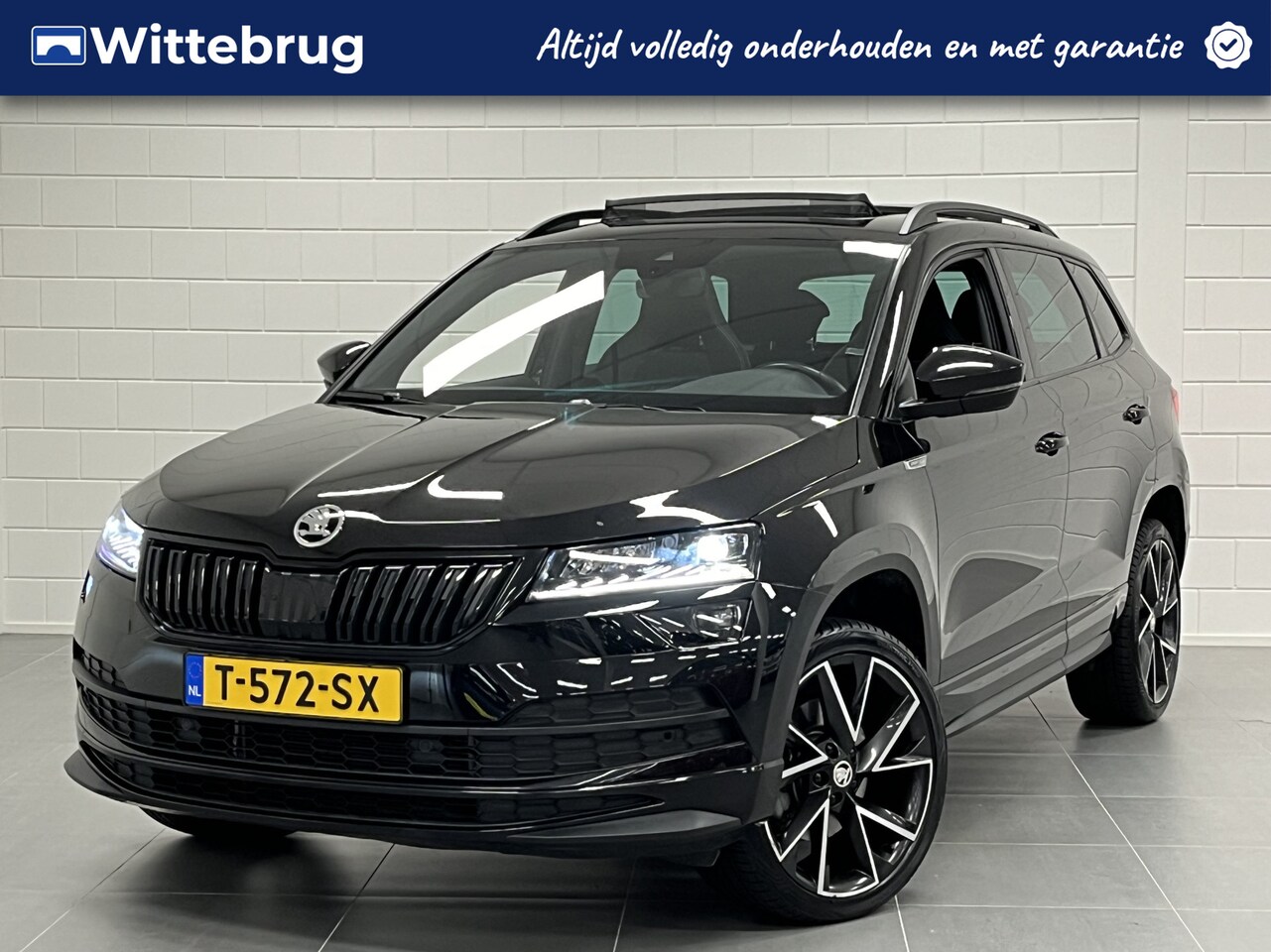 Skoda Karoq - 1.5 TSI ACT Sportline DSG 7 AUTOMAAT | FULL LED | STOELVERWARMING | NAVIGATIE | PANORAMADA - AutoWereld.nl