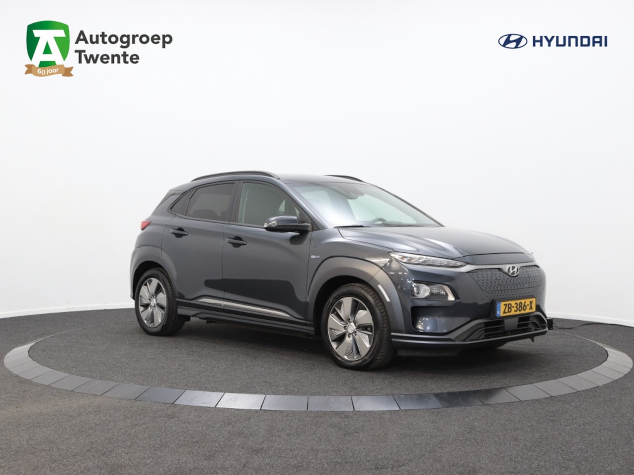 Hyundai Kona Electric - EV Premium 64 kWh | Leer | Navigatie | Camera | Carplay | - AutoWereld.nl