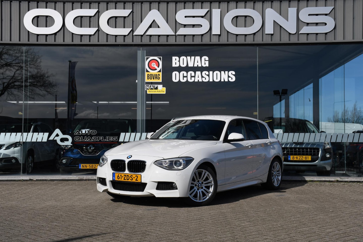 BMW 1-serie - 114i Business+ NAVIGATIE/ LEDER/ LM 17/ PDC - AutoWereld.nl