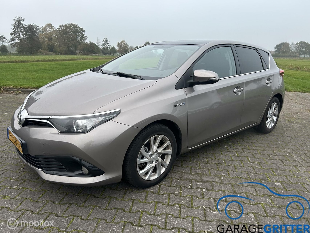 Toyota Auris - 1.8 Hybrid Lease Pro PANO/CAMERA/TREKHAAK - AutoWereld.nl