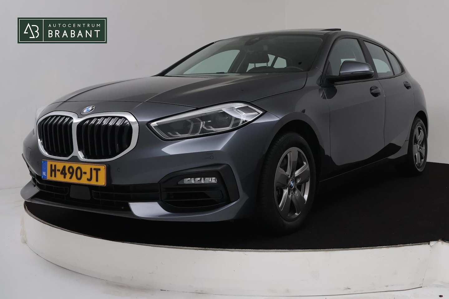 BMW 1-serie - 118i Executive Edition Automaat (PANORAMADAK, NAVIGATIE, CAMERA, PDC, CRUISE, SFEERV, NL-A - AutoWereld.nl