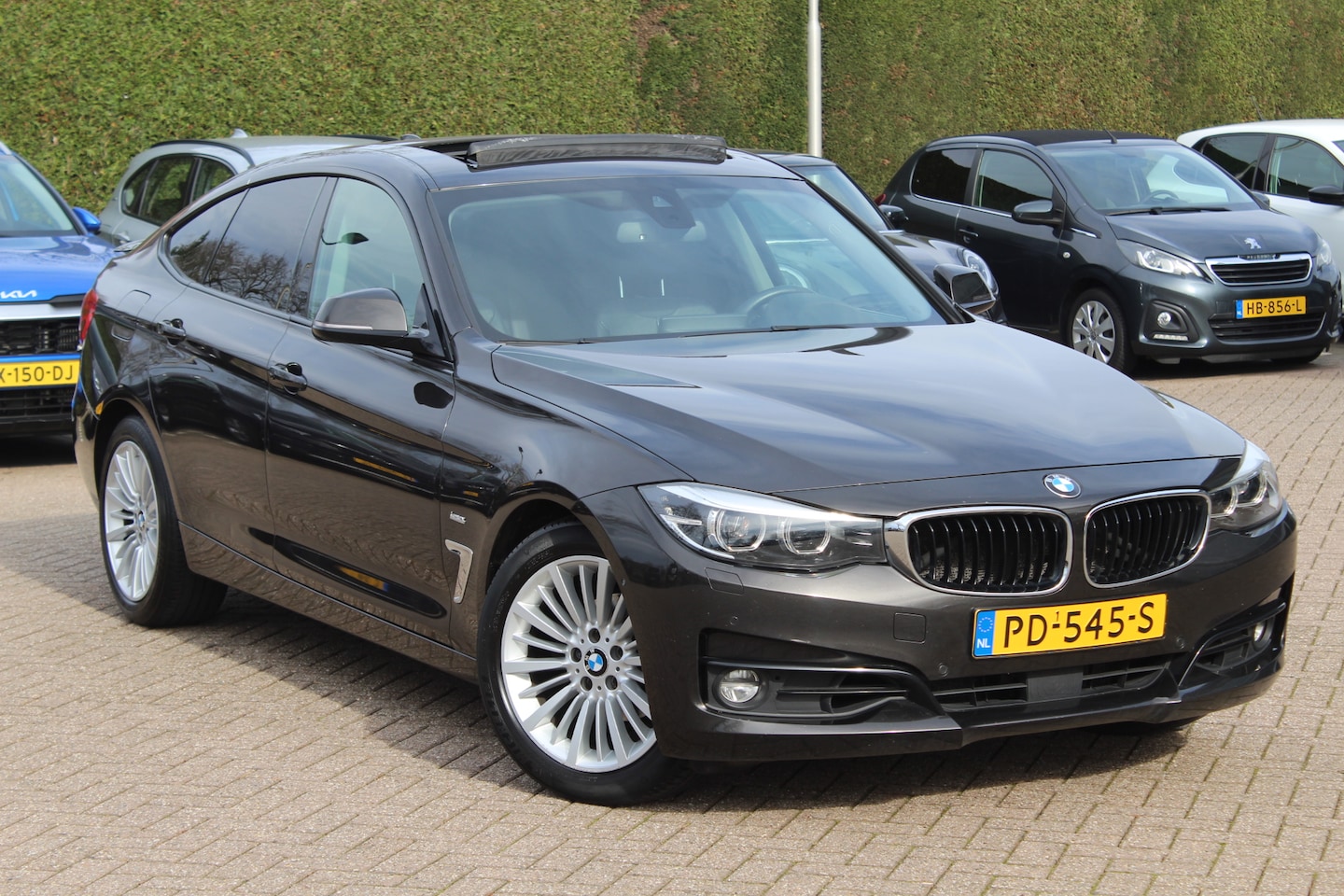 BMW 3-serie Gran Turismo - 320i High Exe. M Sport / Panoramadak / Head-up / Camera / Leder / Navigatie / Cruise Contr - AutoWereld.nl