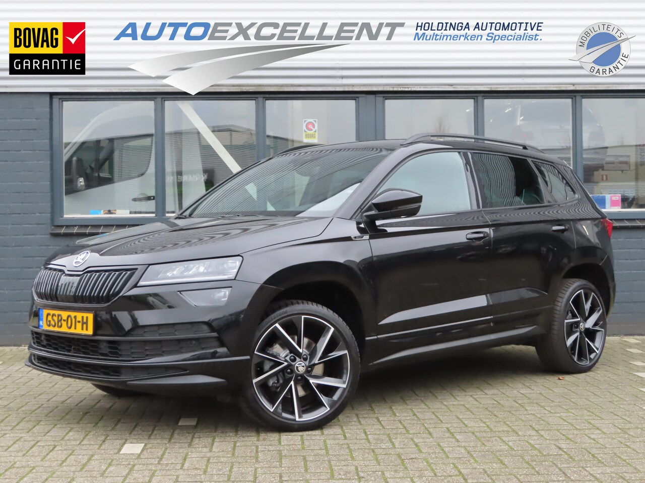 Skoda Karoq - 1.5 TSI ACT Sportline Business | navigatie | verwarmde voorstoelen + achterbank | verwarmb - AutoWereld.nl