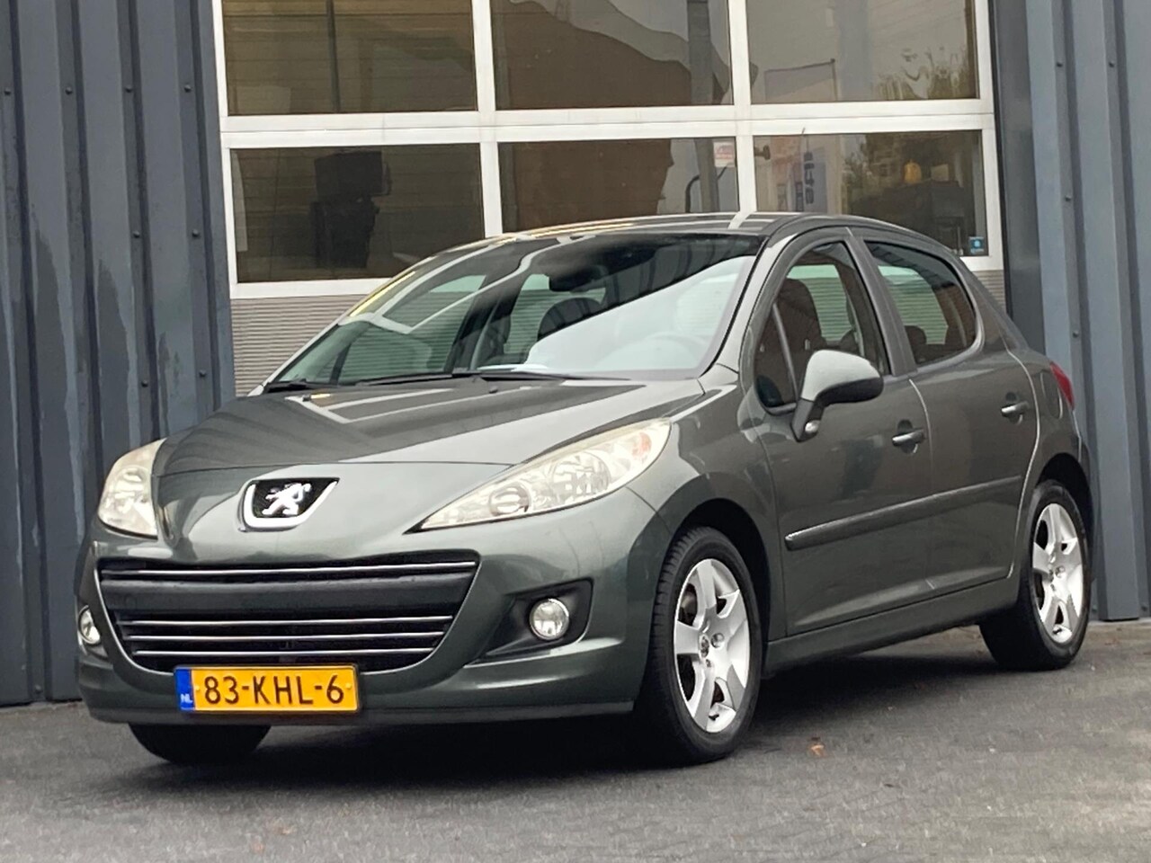 Peugeot 207 - 1.6 VTi Première Clima Navi Dealer onderhouden - AutoWereld.nl