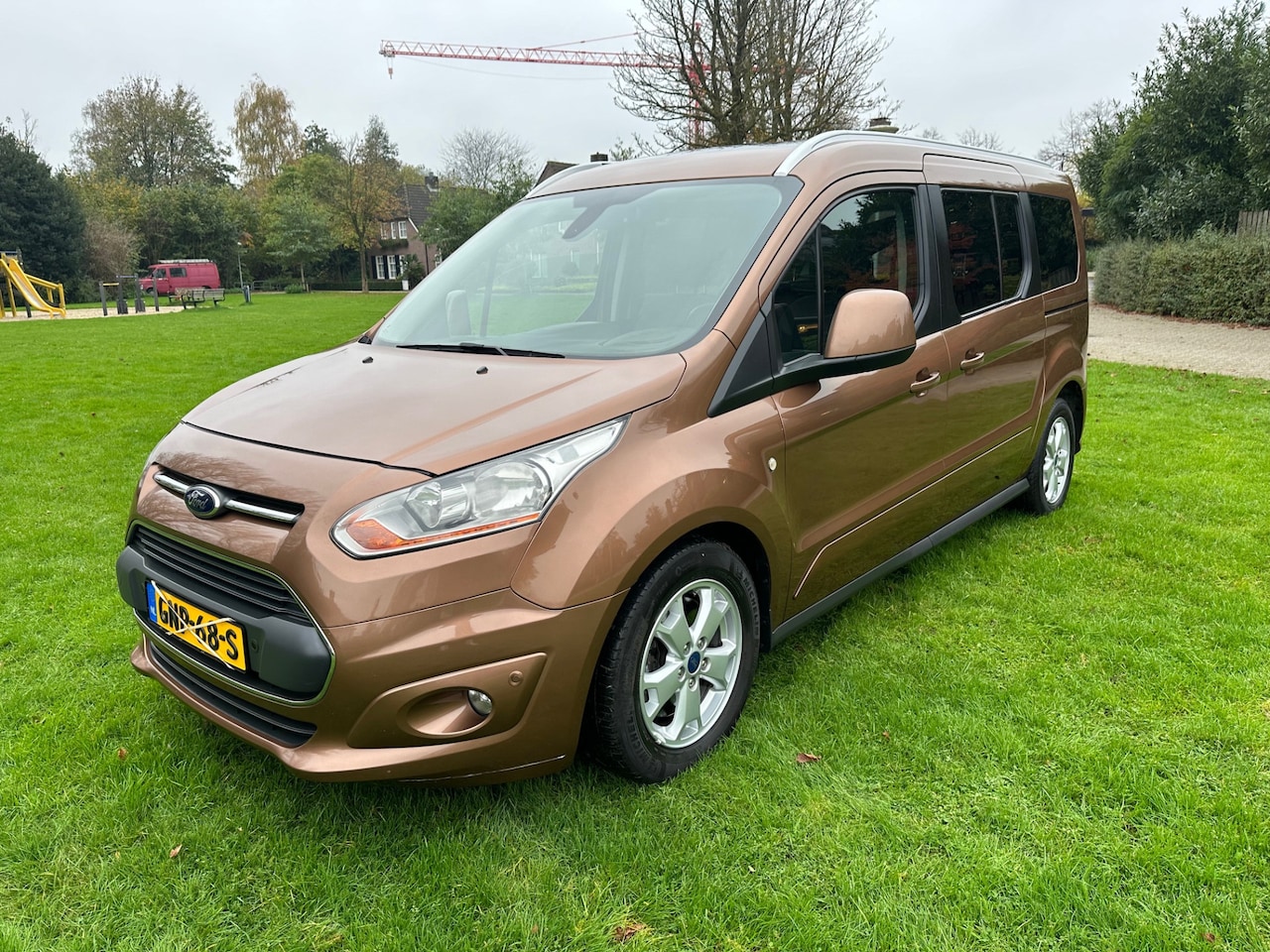 Ford Tourneo Connect Grand - 1.6 Titanium AANPASSING HANDGAS EN REM*AIRCO*PANO-DAK*CAMERA* - AutoWereld.nl