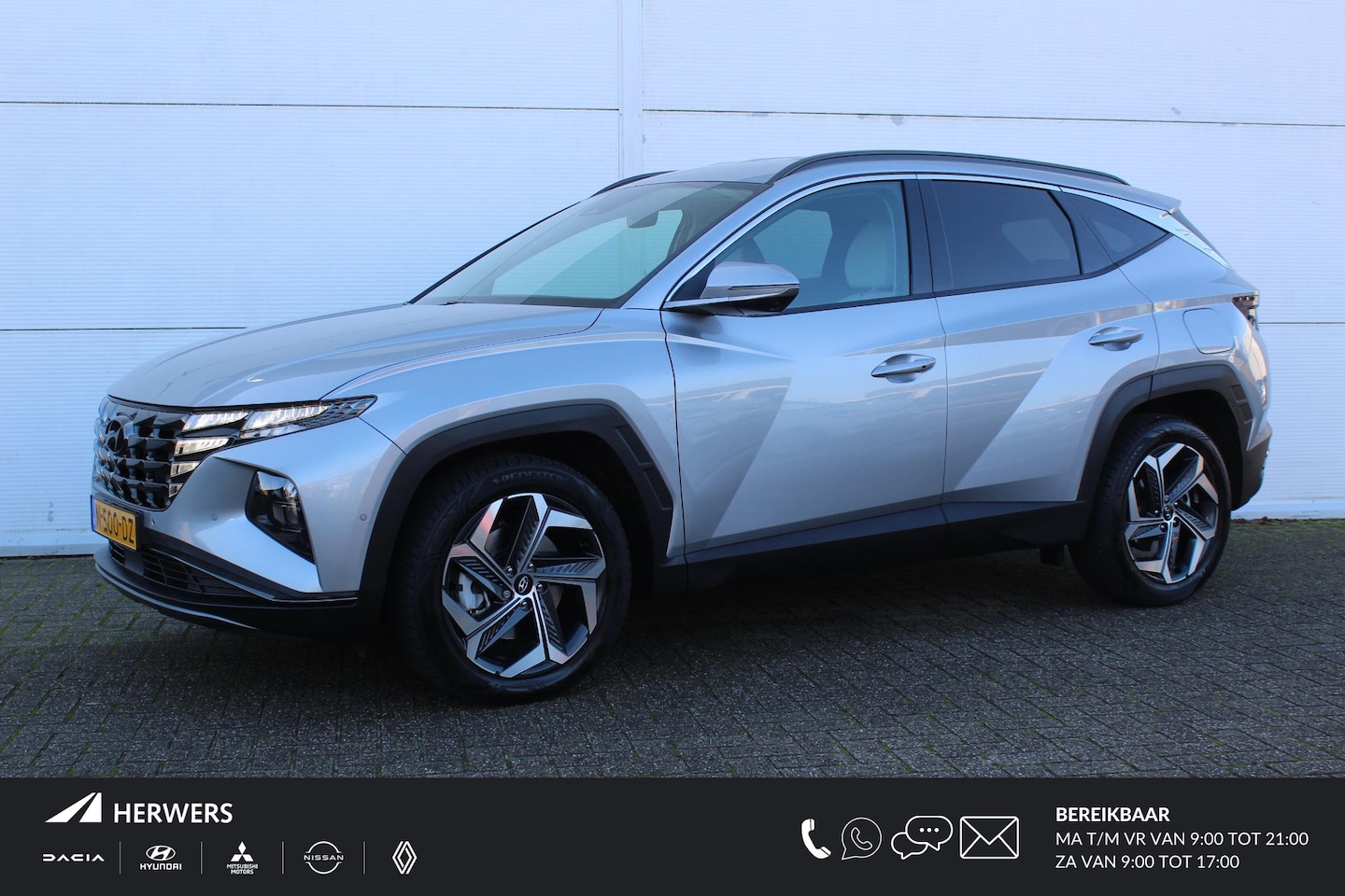 Hyundai Tucson - 1.6 T-GDI HEV Premium / Navigatie + Apple Carplay/Android Auto / Lederen Bekleding / Stoel - AutoWereld.nl