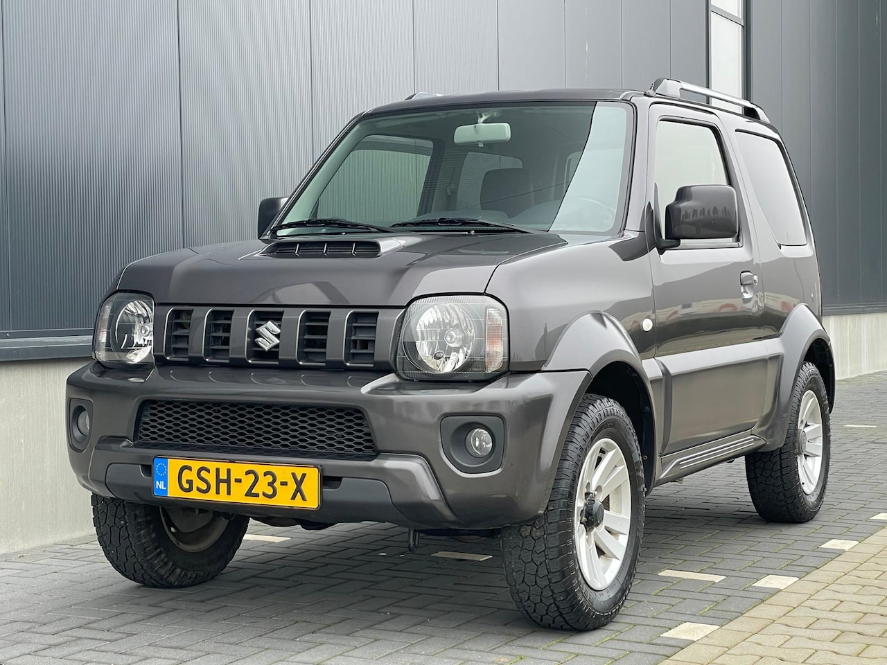 Suzuki Jimny - 1.3 Exclusive 4WD Airco Leer Trekhaak Stoelverw. - AutoWereld.nl