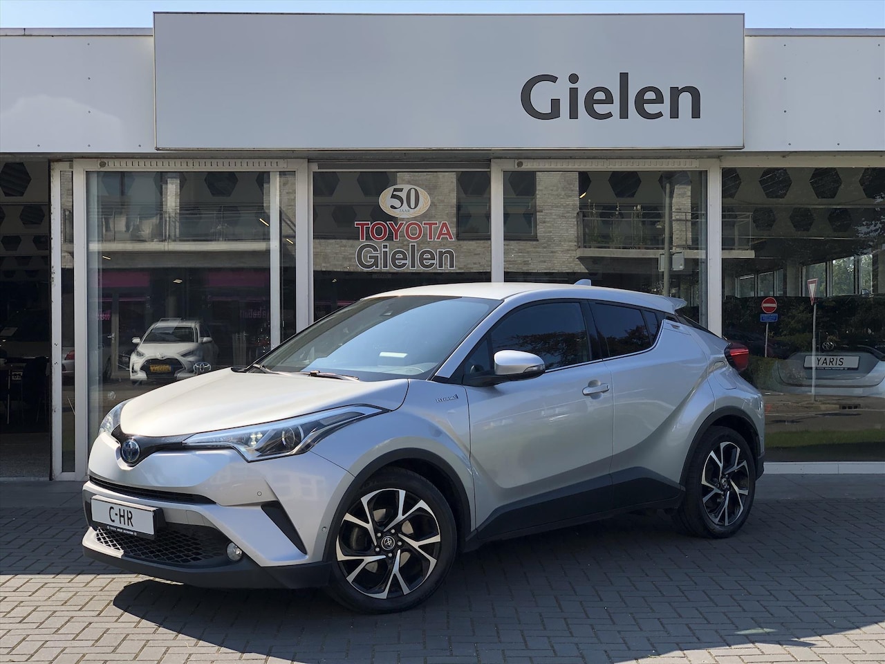 Toyota C-HR - 1.8 Hybrid Style | Dodehoekherkenning, Parkeersensoren, Stoel + Stuurverwarming, Keyless, - AutoWereld.nl