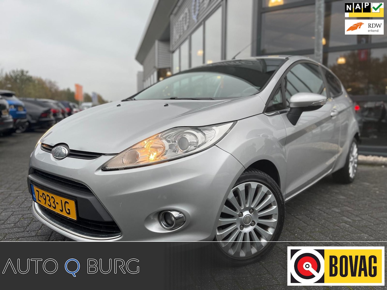 Ford Fiesta - 1.4 Ghia | Stoelverwarming | Climate Control | Airco | LMV | Leer | - AutoWereld.nl