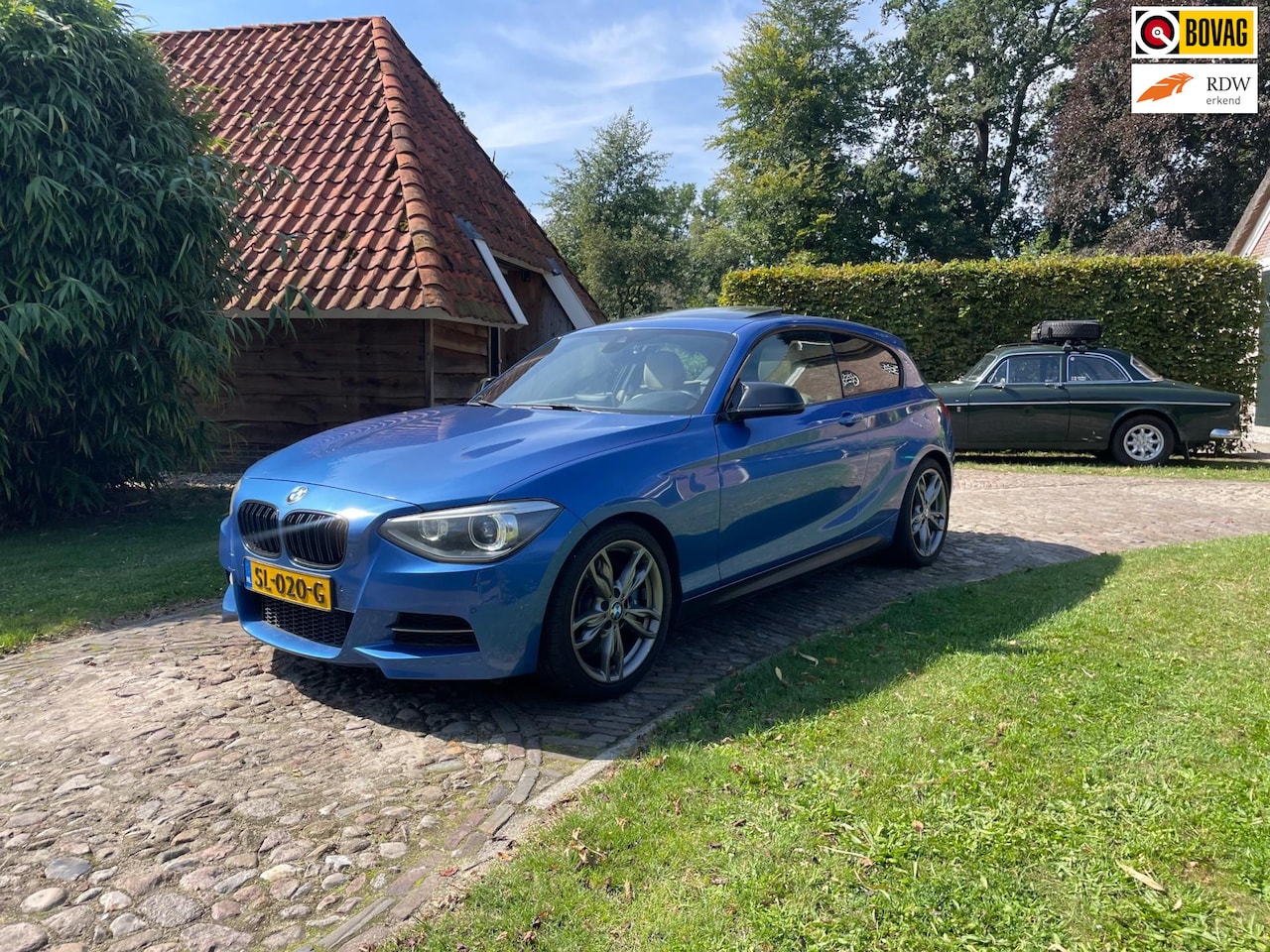 BMW 1-serie - M135i-320PK-LEER-CAMERA-AKRAPOVIC-XENON- - AutoWereld.nl