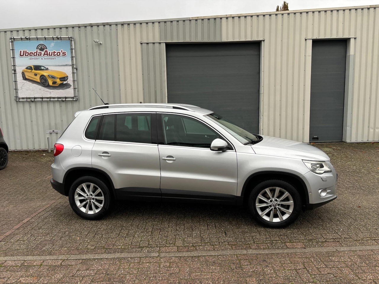 Volkswagen Tiguan - 1.4 TSI Sport&Style 4X4 MOTION NL AUTO --5750E - AutoWereld.nl