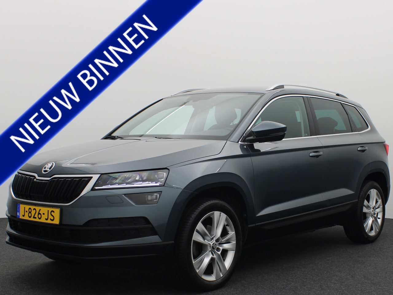 Skoda Karoq - 1.5 TSI ACT Business Edition AUTOMAAT / LEDER-ALCANTARA / STOELVERW / FULL LED / CAMERA / - AutoWereld.nl